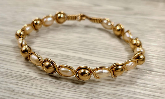 14k Yellow Gold and pearl Bangle Bracelet ( comes with appraisal)
